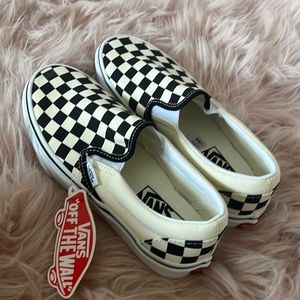Never worn classic slip on checkerboard vans. Size 6.5 woman